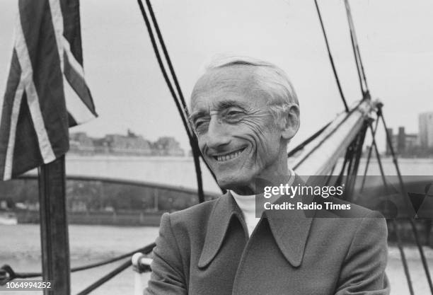 Portrait of explorer Jacques Cousteau on the deck of a boat, photographed in connection with the television show 'The Undersea World of Jacques...