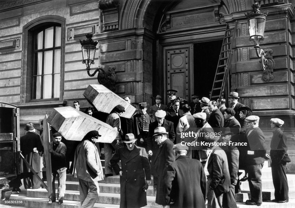 Coffins With Dead From The Fire Are Carried To The Marseille Library In 1938
