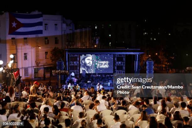 Pictures of late Cuban revolution leader Fidel Castro are displayed as thousands of students commemorate the second anniversary of Castro's death, at...