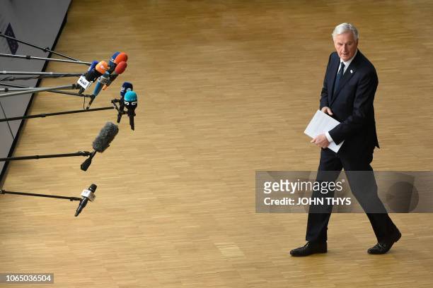 Chief Brexit negotiator Michel Barnier speaks to the press as he arrives at a special meeting of the European Council to endorse the draft Brexit...