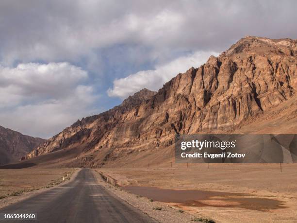 pamir highway in the eastern pamirs in tajikistan - afghanistan desert stock pictures, royalty-free photos & images