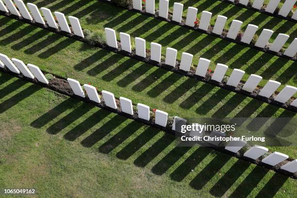 The sun casts shadows from the headstones of the fallen in Tyne Cot Military Cemetery in Flanders Fields on November 06, 2018 in Ypres, Belgium. The...