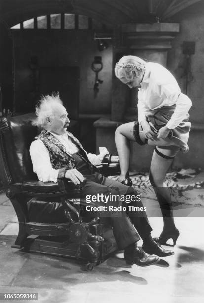 Actors Kenneth Connor and Kim Hartman in a scene from episode 'The Exploding Bedpan' of the television sitcom ''Allo! 'Allo!', May 20th 1988.