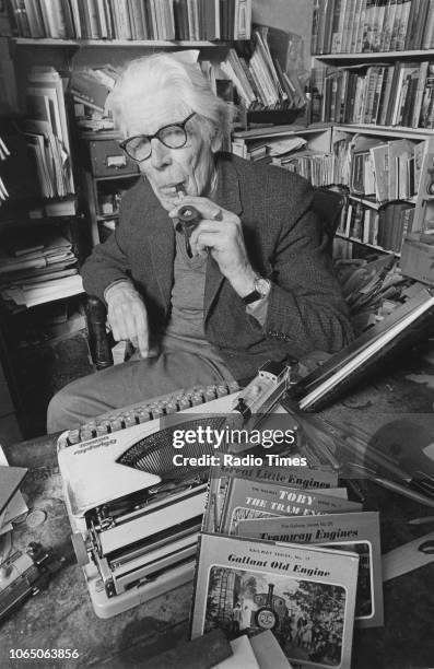 Portrait of author Wilbert Awdry with his typewriter and some of his 'Thomas the Tank Engine' books, March 13th 1986.