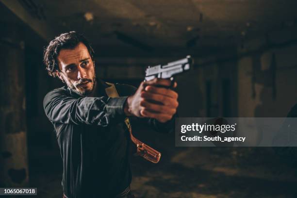 detective holding a gun - gangster stock pictures, royalty-free photos & images