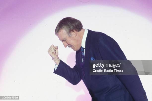 Entertainer Bruce Forsyth striking his famous pose while presenting the BBC television show 'The Generation Game', September 20th 1994.