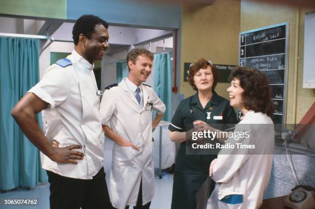 Actors George Harris, Derek Thompson, Brenda Fricker and Julia Watson in a scene from episode 'Gas' of the BBC television series 'Casualty', March...