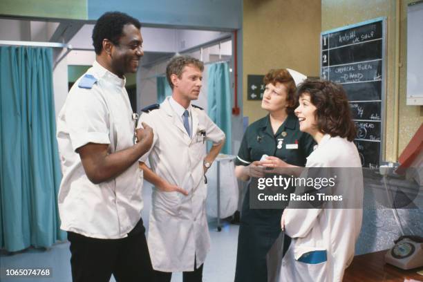 Actors George Harris, Derek Thompson, Brenda Fricker and Julia Watson in a scene from episode 'Gas' of the BBC television series 'Casualty', March...