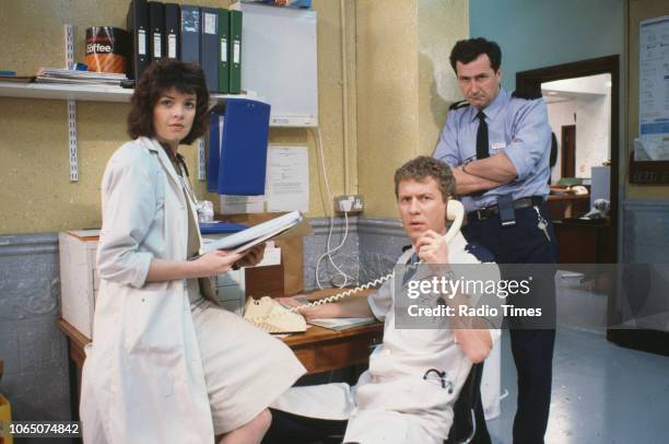 Actors Julia Watson, Derek Thompson and Christopher Rozycki in a scene from episode 'Gas' of the BBC television series 'Casualty', March 21st 1986.