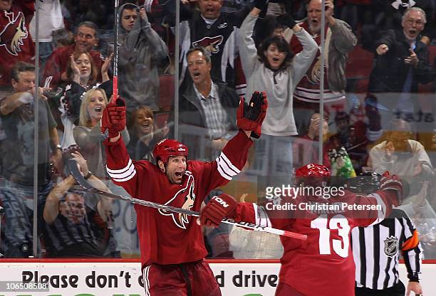 Ed Jovanovski of the Phoenix Coyotes celebrates with teammate Ray Whitney after Jovanovski scored his third goal of the night against the Nashville...