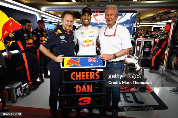 Daniel Ricciardo of Australia and Red Bull Racing poses for a photo with Red Bull Racing Team Principal Christian Horner and Red Bull Racing Team...