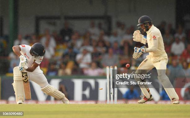 England keeper Ben Foakes reacts as Sri Lanka batsman Dimuth Karunaratne is bowled by Moeen Ali during Day Three of the Third Test match between Sri...