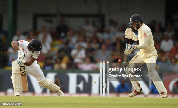 England keeper Ben Foakes reacts as Sri Lanka batsman Dimuth Karunaratne is bowled by Moeen Ali during Day Three of the Third Test match between Sri...