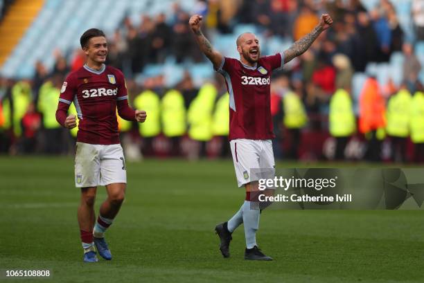 Jack Grealish of Aston Villa and Alan Hutton of Aston Villa celebrate at the end of the Sky Bet Championship match between Aston Villa and Birmingham...