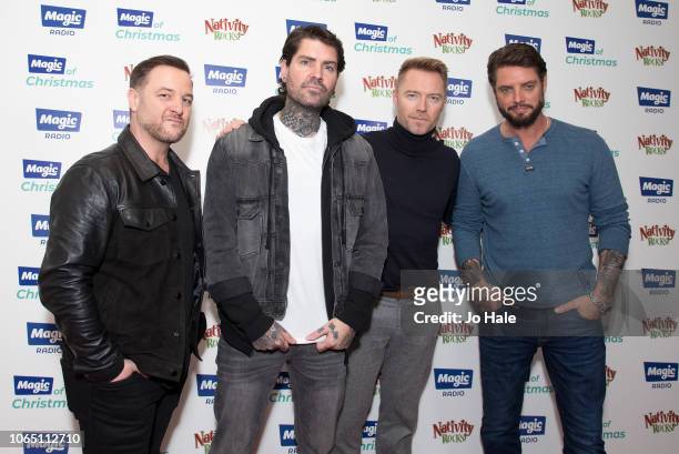 Mikey Graham, Shane Lynch, Ronan Keating and Keith Duffy of Boyzone attend Magic Of Christmas, in association with Magic FM, at London Palladium on...