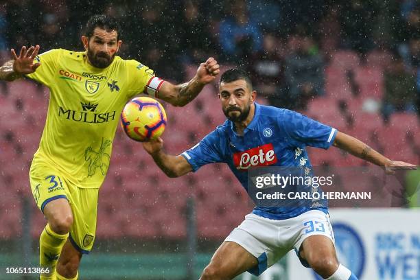 Chievo's Serbian defender Strahinja Tanasijevic and Napoli's Spanish defender Raul Albiol go for the ball during the Italian Serie A football match...