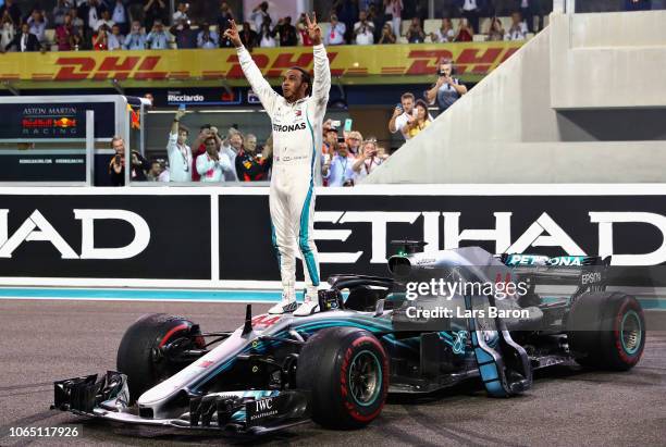 Race winner Lewis Hamilton of Great Britain and Mercedes GP celebrates on track during the Abu Dhabi Formula One Grand Prix at Yas Marina Circuit on...