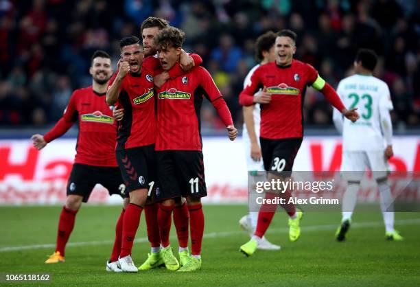 Luca Waldschmidt of Freiburg celebrate with his team mates after he scores the opening goal by penalty during the Bundesliga match between Sport-Club...