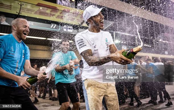 Race winner Lewis Hamilton of Great Britain and Mercedes GP celebrates with his team after the Abu Dhabi Formula One Grand Prix at Yas Marina Circuit...