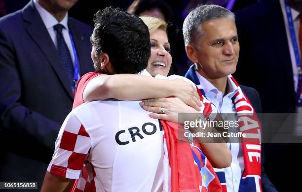 President of Croatia Kolinda Grabar-Kitarovic greets Marin Cilic of Croatia after he wins his single and the Davis Cup during day 3 of the 2018 Davis...