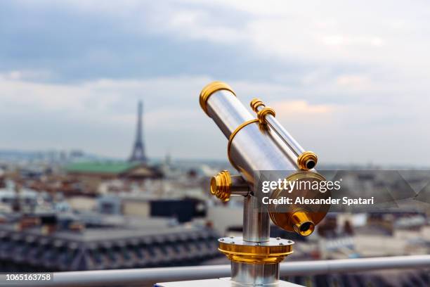 coin operated telescope overlooking paris skyline with eiffel tower, paris, france - coin operated binocular nobody stock pictures, royalty-free photos & images