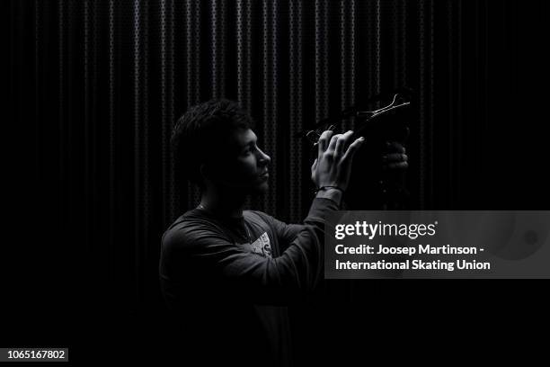 Dmitri Aliev of Russia poses for a photo during day 3 of the ISU Grand Prix of Figure Skating Internationaux de France at Polesud Ice Skating Rink on...