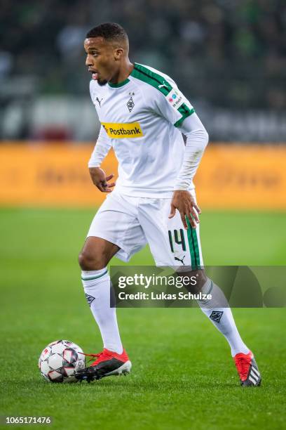 Alassane Plea of Moenchengladbach controls the ball during the Bundesliga match between Borussia Moenchengladbach and Hannover 96 at Borussia-Park on...