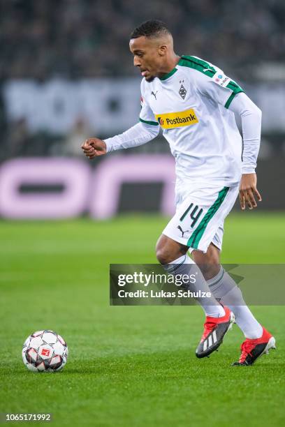 Alassane Plea of Moenchengladbach controls the ball during the Bundesliga match between Borussia Moenchengladbach and Hannover 96 at Borussia-Park on...