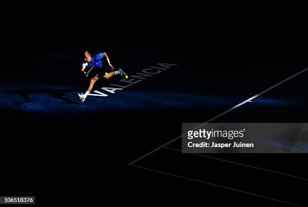 Nikolay Davydenko of Russia jumps to play a backhand to Juan Ignacio Chela of Argentina in his second round match during the ATP 500 World Tour...