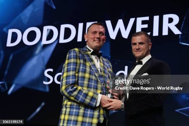 Doddie Weir receives the Award for Character in association with Land Rover from Jamie Heaslip of Ireland during the World Rugby via Getty Images...
