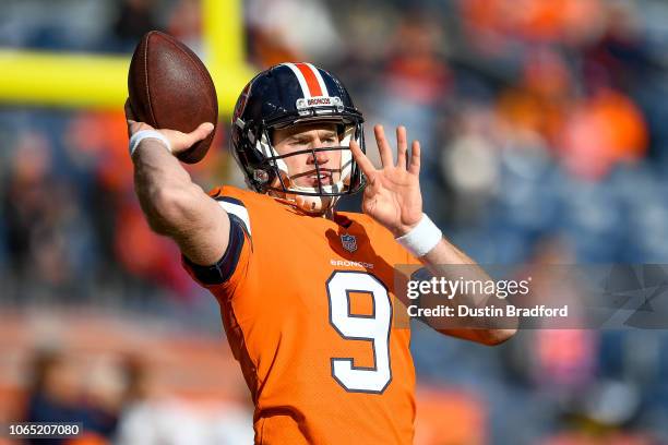 Quarterback Kevin Hogan of the Denver Broncos throws as he warms up before a game against the Pittsburgh Steelers at Broncos Stadium at Mile High on...