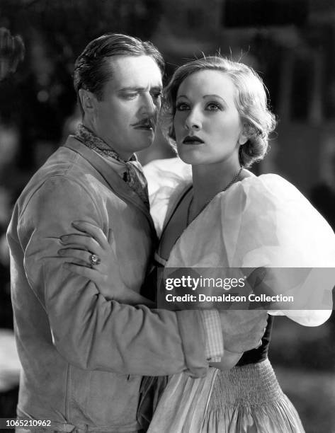 Actress Tala Birell and Edmund Lowe in a scene from the movie "Let's Fall in Love"