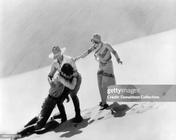 Actress Nancy Carroll, John Boles and Jack Holt in a scene from the movie "The Water Hole"