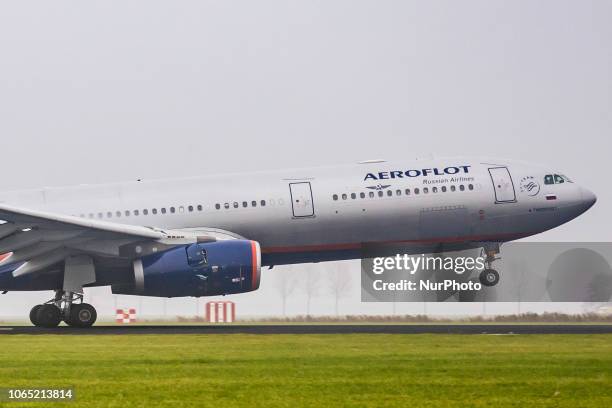 Aeroflot - Russian Airlines Airbus A330-343 with registration VQ-BEK landing at Amsterdam Schiphol International Airport in a weather with haze. The...