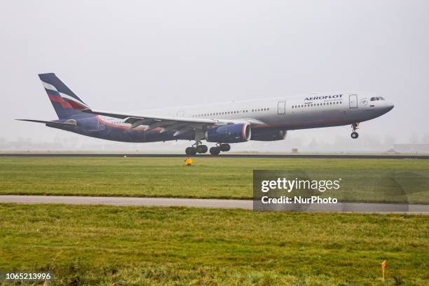 Aeroflot - Russian Airlines Airbus A330-343 with registration VQ-BEK landing at Amsterdam Schiphol International Airport in a weather with haze. The...