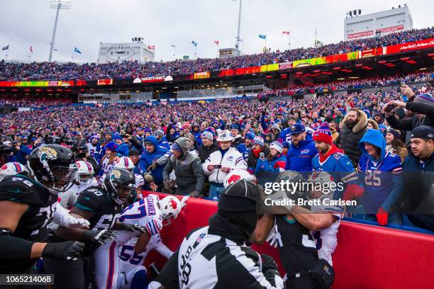 Members of both teams scuffle during the third quarter of the game between the Buffalo Bills and the Jacksonville Jaguars at New Era Field on...