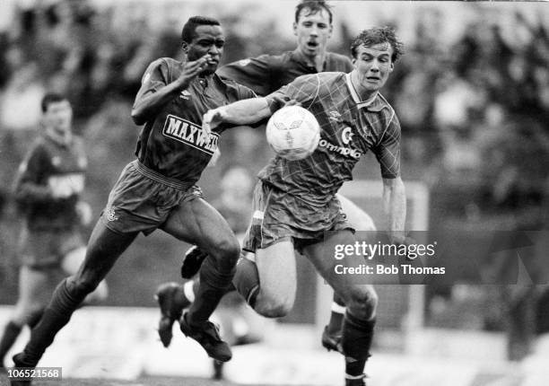 Kerry Dixon of Chelsea clashes with Earl Barrett of Oldham Athletic during a Division Two football match held at Stamford Bridge, London on 25th...