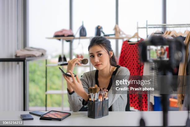 asian teenage elegant girl recording her make up tutorial. beauty blogger. - fashion blogger stock pictures, royalty-free photos & images