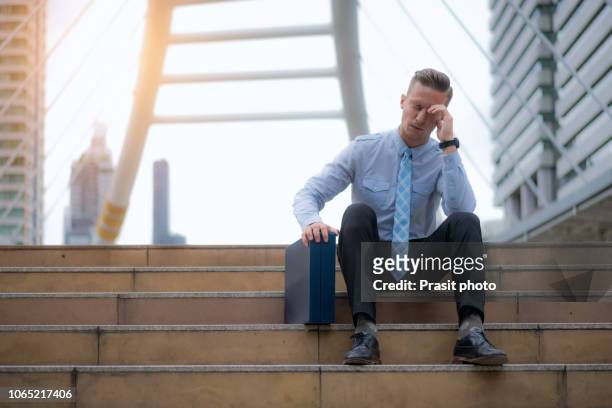 frustrated stressed young asian business man feeling tired and exhausted with job - losing money stock pictures, royalty-free photos & images