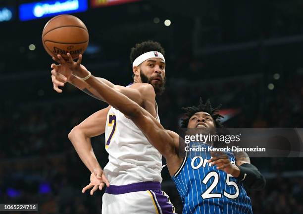 JaVale McGee of the Los Angeles Lakers blocks a layup by Wesley Iwundu of the Orlando Magic during the first half at Staples Center on November 25,...