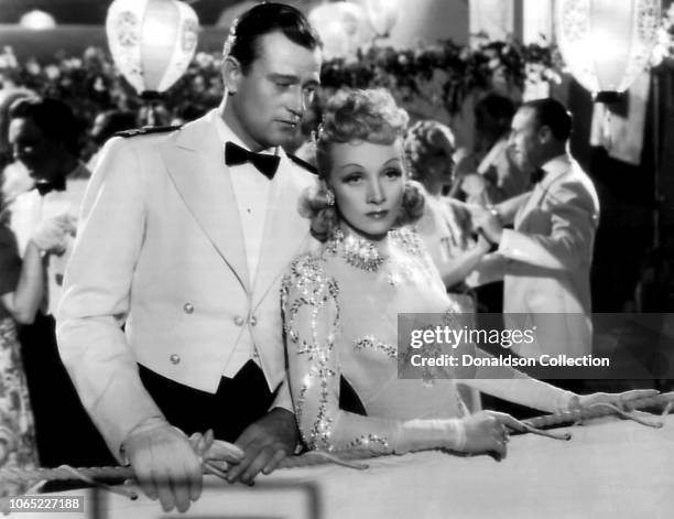 Actress Marlene Dietrich and John Wayne in a scene from the movie "Seven Sinners"