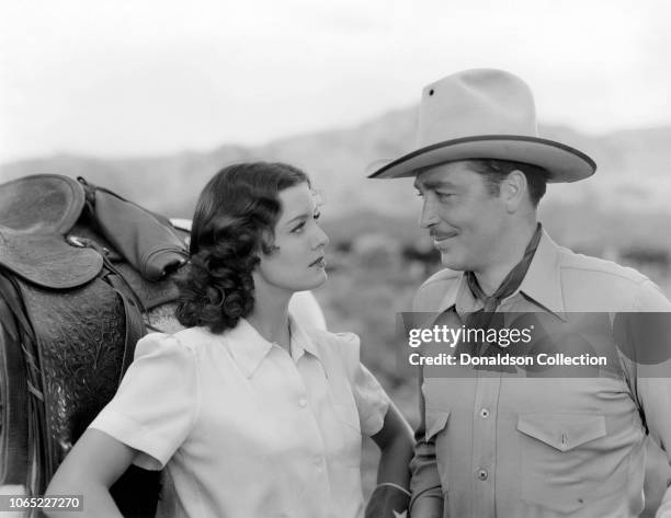 Actress Ellen Drew and John Howard in a scene from the movie "The Texas Rangers Ride Again"