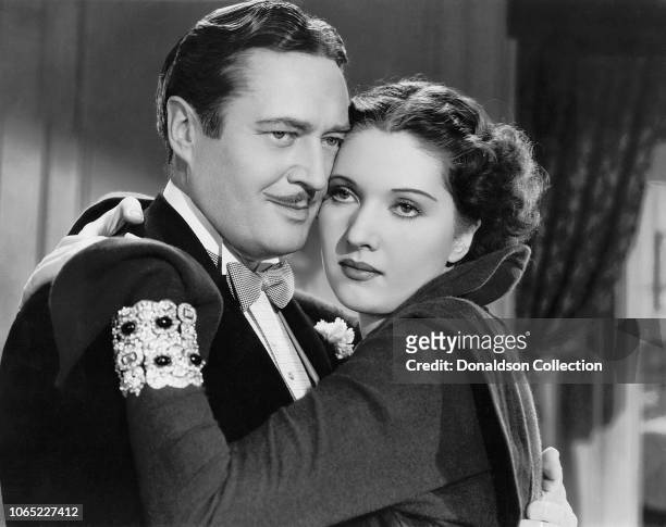 Actress Wera Engels and Edmund Lowe in a scene from the movie "The Great Impersonation"