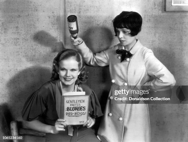 Actress Jean Harlow and screenwriter Anita Loos in a scene from the movie "Red-Headed Woman"