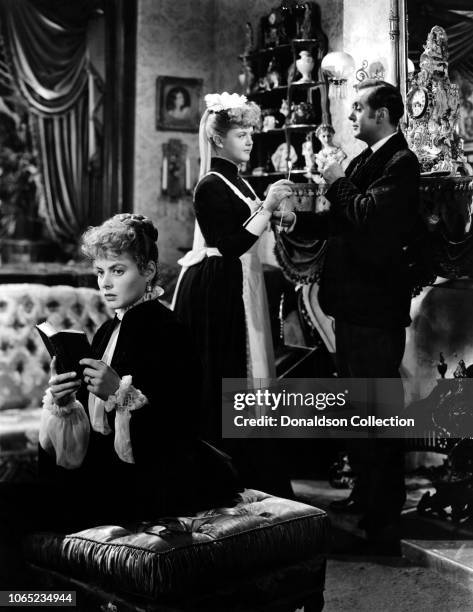 Actress Angela Lansbury, Ingrid Bergman, Charles Boyer in a scene from the movie "Gaslight"