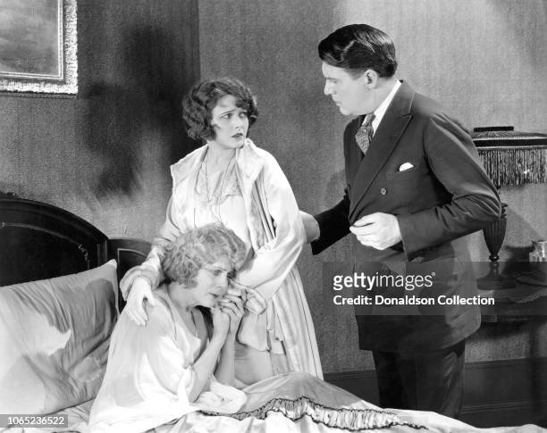Actress Corinne Griffith, Kathlyn Williams and Jere Austin in a scene from the movie "Single Wives"
