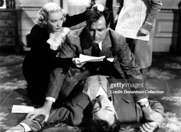 Actress Miriam Hopkins, William Hopkins, Broderick Crawford in a scene from the movie "Woman Chases Man"