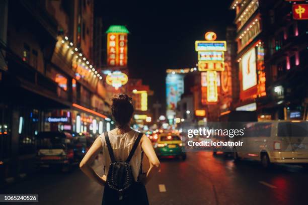 tourist woman in bangkok at night - thailand city night stock pictures, royalty-free photos & images