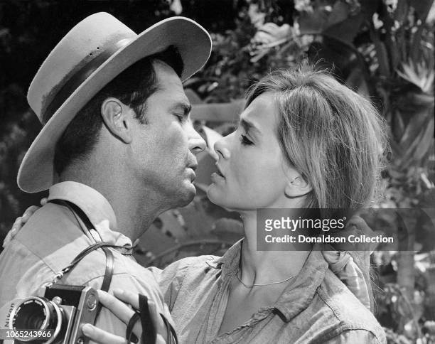 Actress Eva Renzi and James Garner in a scene from the movie "The Pink Jungle"
