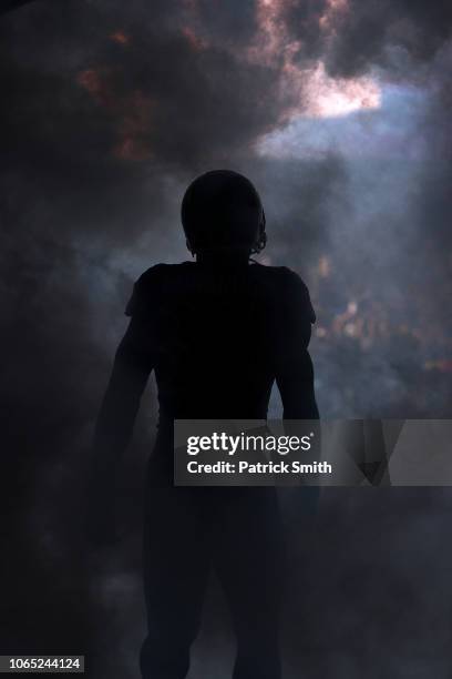 Running back Gus Edwards of the Baltimore Ravens is introduced before playing against the Oakland Raiders at M&T Bank Stadium on November 25, 2018 in...